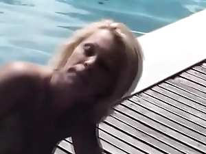 Blonde slut Dolly Blond sucks on a lucky man'_s cock outside by the pool