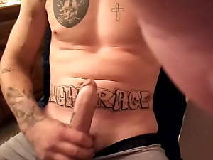 Hot guy with tattoos playing with huge cock